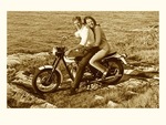 couple-on-motorcycle-by-sea-retro.jpeg